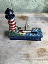 Vintage Cast Iron Lighthouse Sailboat Mechanical Coin Bank Red White Stripes