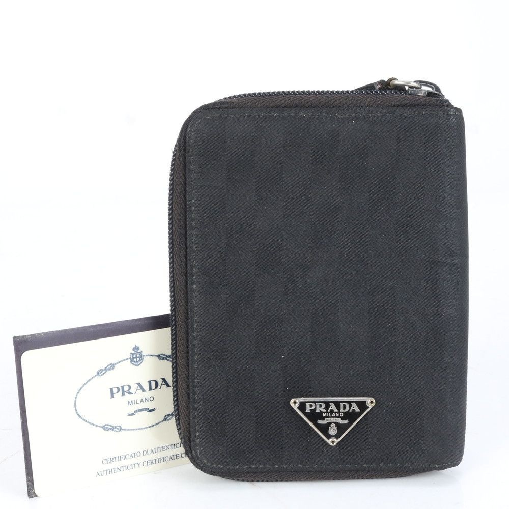 Prada nylon bifold wallet with card slots and triangular logo