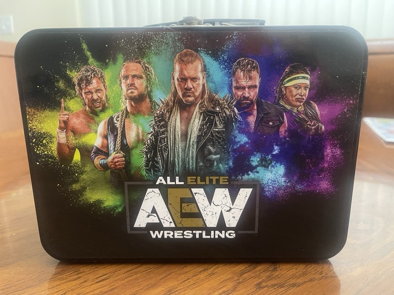 AEW Lunch Box Year One. Features Chris Jericho, Omega, Moxley, Hangman Page