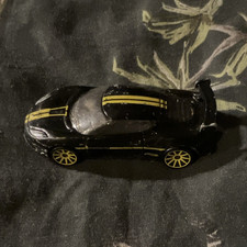2013 HotWheels Lotus Evora GT4 toy car black/yellow