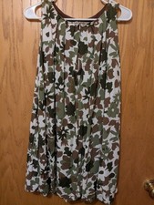 A sleeveless A-line swing mini dress