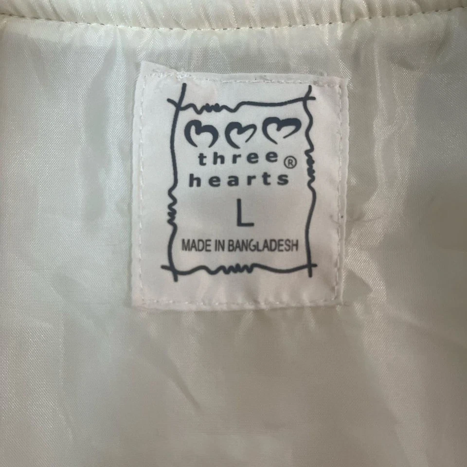 Chaleco acolchado Three Hearts crema con cuello de piel sintética Foto 3 de 4