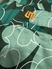 Loudmouth Golf skort featuring a green shamrock clover pattern — photo 8