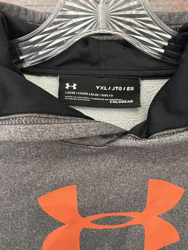 Sudadera con Capucha Under Armour Gris/Naranja COLDGEAR Calce Suelto Usada en Excelente Condición Para Niños Talla XL Foto 2 de 4