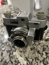 AI Overview 1The item is a vintage Kodak 35 Rangefinder camera.