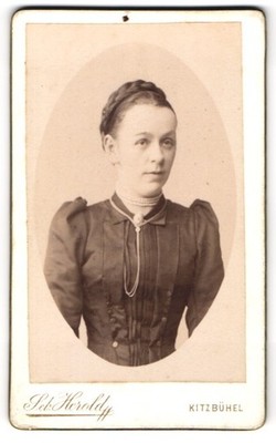 Photograph Seb. Herald, Kitzbühel, young lady with braided hairstyle and striking St 