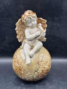 European Stoneware cherub sitting on a Sphere holding a Lyre 9.5” Tall Wt. 2.78