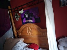 Elegant Solid Wood Four Poster Bed with Wrought Iron Canopy