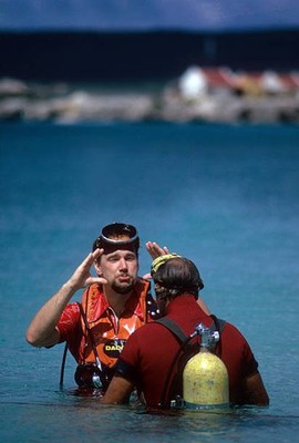 Portrait of Stan Hill speaking to scuba diving instructor Don Stew- Old Photo