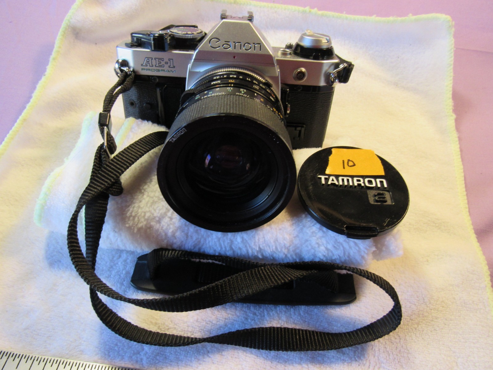 Cannon AE 1 camera with yucksack and misc. attachments