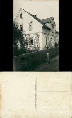 Father with child in his arms and little boy in front of the house, Dresden 1920