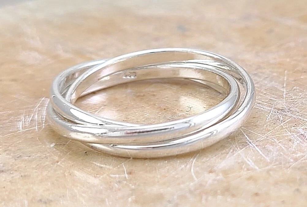 Sterling silver rolling ring deals