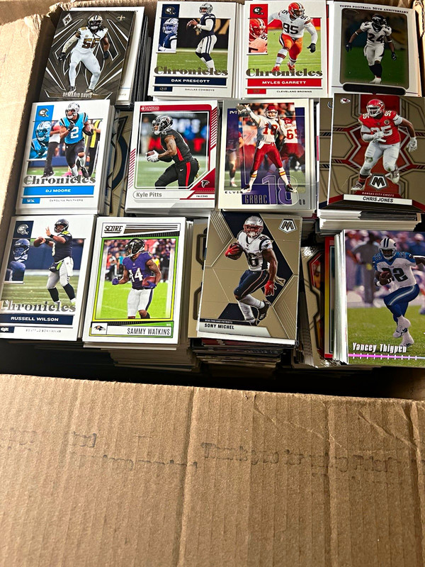 Box Full of football cards it’s 8.5 inches high by 12 inches by 12 inches 20 #