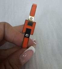 Damen Armreif orange/goldfarben mit H-Motiv &...