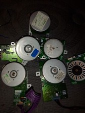 used stepper motors. Assorted size and volts. 17 motors in all 