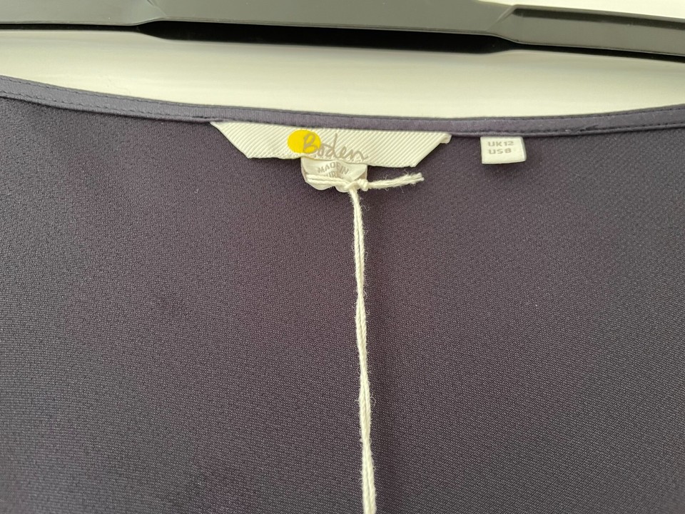 Ladies blue satin skirt by Boden. Size 12, bias cut, midi length. Never