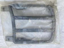 1969 RS Headlight hinge bracket. New still in package.