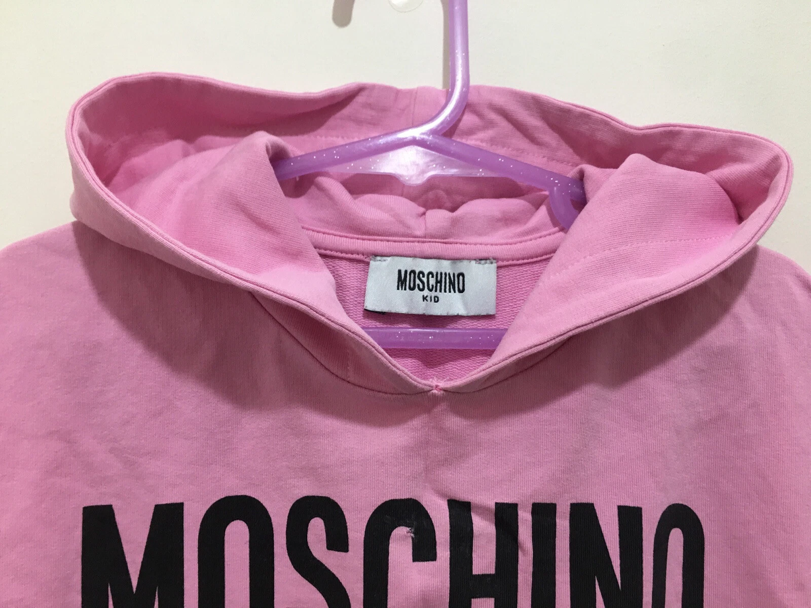 Felpa con cappuccio rosa tagliata per ragazze designer Moschino couture 6 anni ?