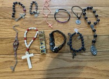 Lot of 11 Catholic Bracelets Mixed Styles Crosses  Saints Stretch Cord