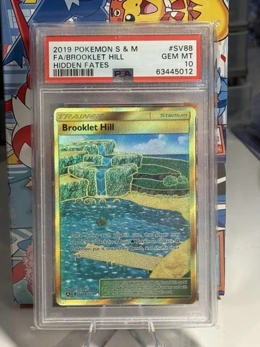 PSA 10 GEM MINT 2019 Pokemon Sun & Moon Hidden Fates Brooklet Hill SV88