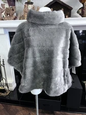 Kate Space Faux Fur Shawl. Gray Shawl with a black bow on the back. 