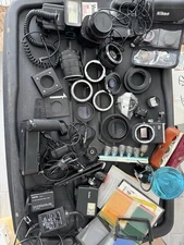Lot of camera lenses adapers and other accessories Read Description 