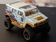 EXCEPTIONAL OFF ROAD HUMMER TM GM W GOLD AIR SHOCKS MFG 2011 1:64 SCALE BY MB