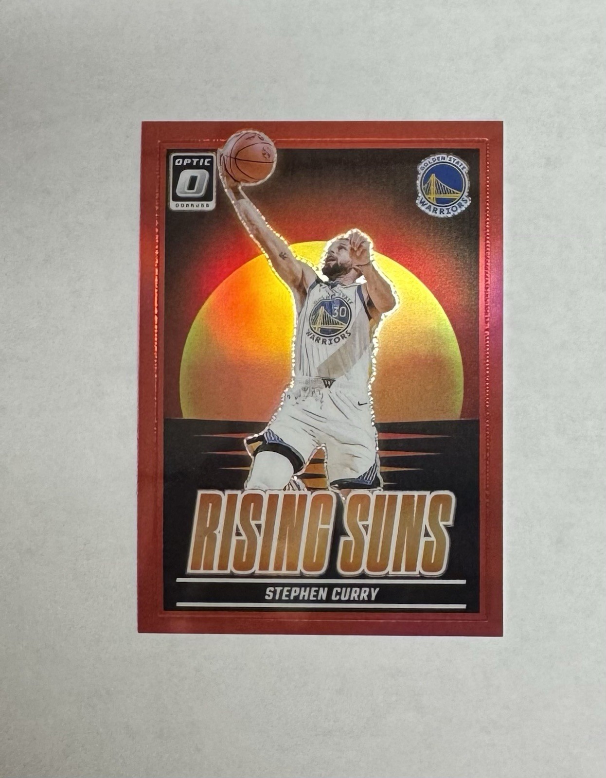 Stephen Curry 2024-25 Panini Optic #18 Rising Suns Red Prizm /99 Warriors