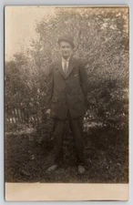 RPPC Handsome Young Man Posing With Tree In Yard  Real Photo Postcard V25