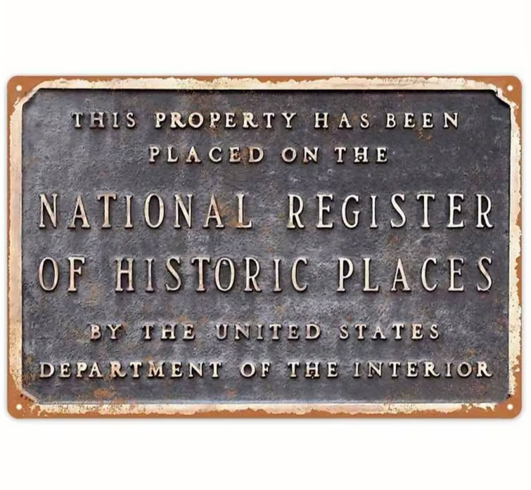 A real-looking "National Register of Historic Places" flat metal sign — dead-pan humor meets surprisingly convincing prop art.