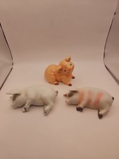 Collection Of 3 Pig Figurines 2 Ceramic Pigs. 1 Resin. One Is Marked Art mark.