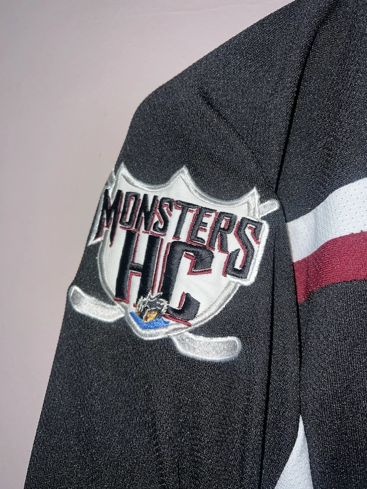 CAMISETA DE HOCKEY DE LIGAS MENORES DE LOS MONSTRUOS DEL LAGO ERIE COSIDA L CLEVELAND Foto 3 de 4