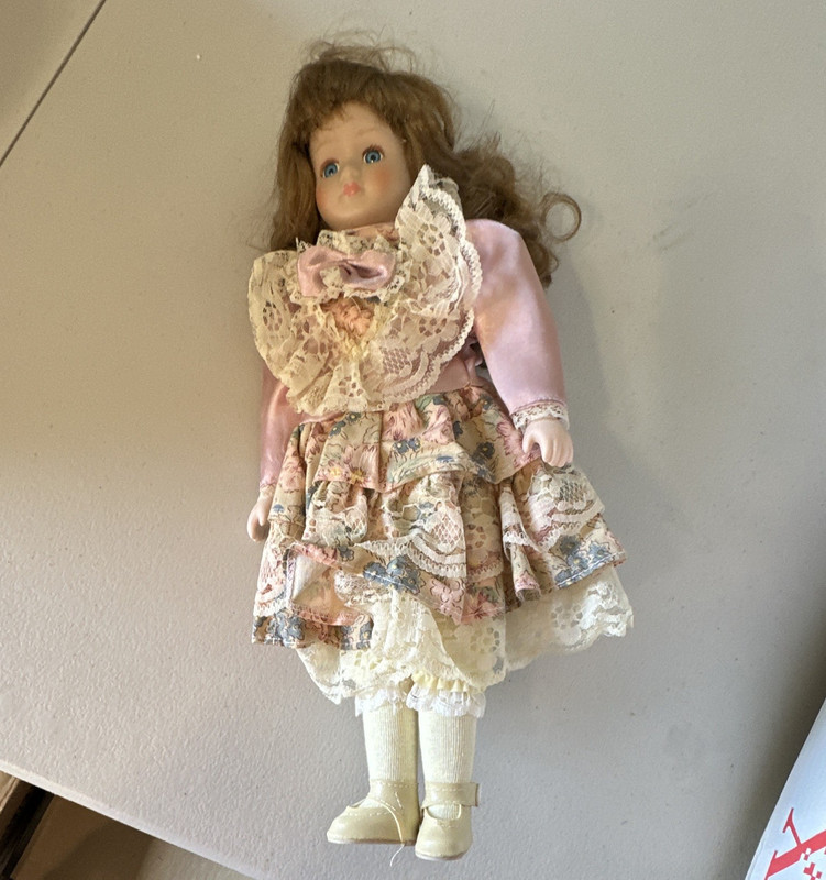World Bazaars, Inc. Porcelain Girl Doll Brown Wavy Hair Pink Lace Dress