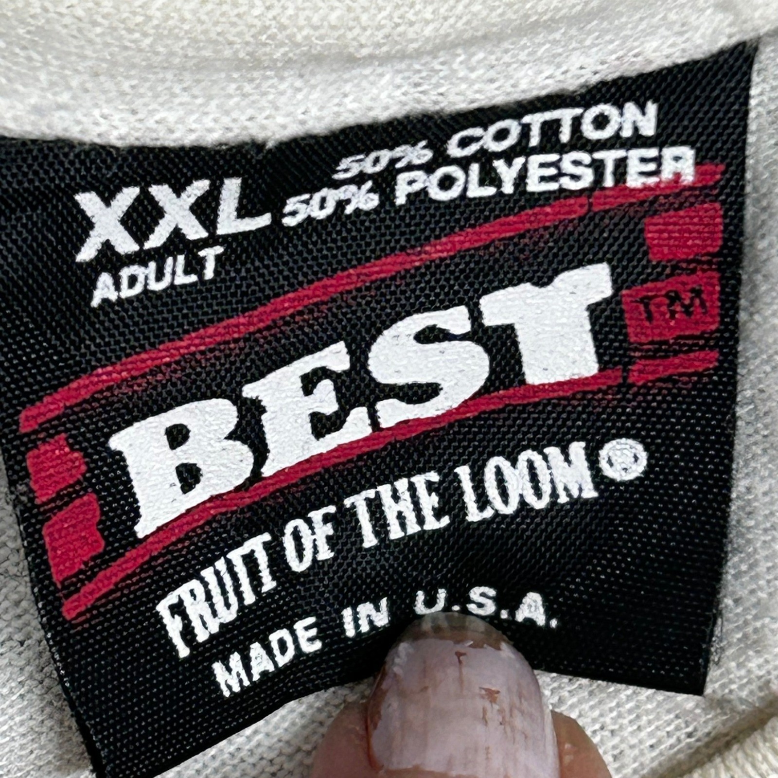Cream Fruit of the Loom men’s XXL T-shirt with red “50% Cotton, 50% Polyester” tag and black “Made in U.S.A.” text.