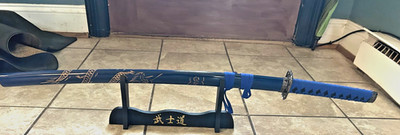 katana used is not plastic, but still works good, comes with holder