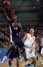 Gary Payton USA makes a leaping layup at the Men's Basketball game- Old Photo