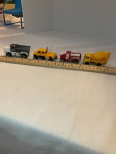 Four work/construction mini toy vehicles various brands