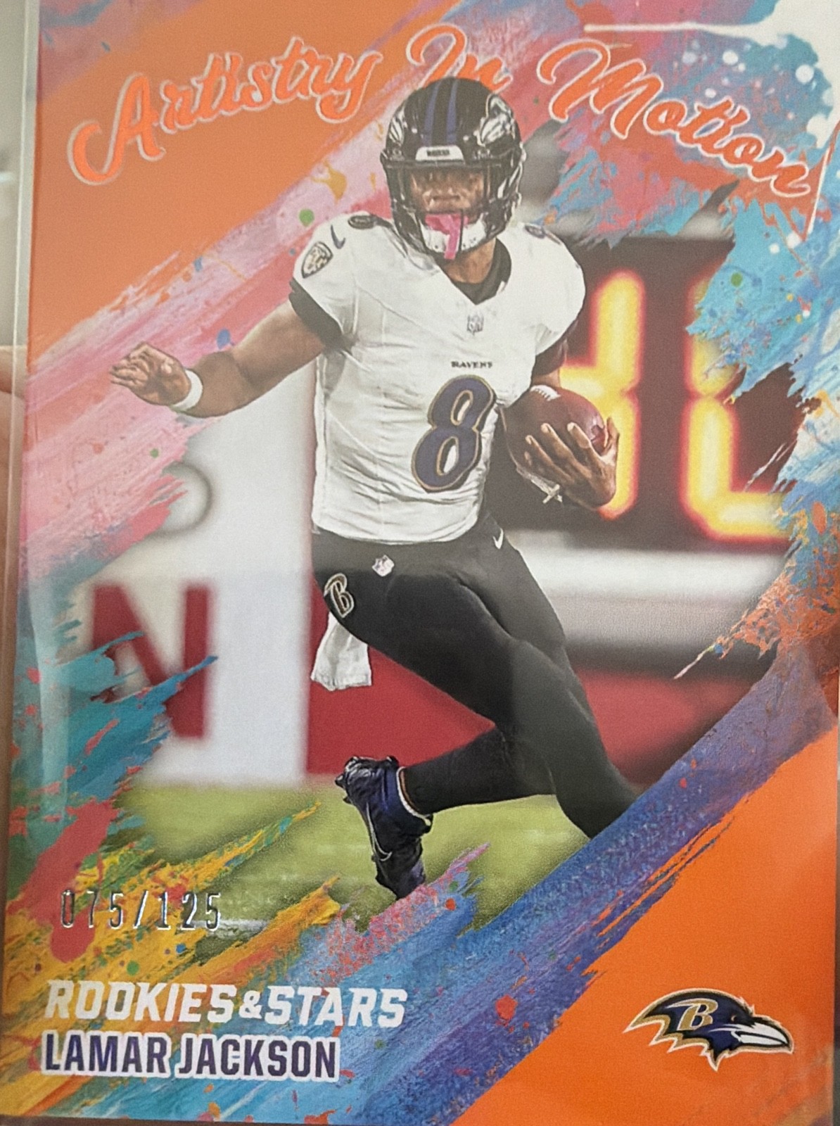 2025 Panini Rookies & Stars - Artistry in Motion Lamar Jackson #2 Orange /125