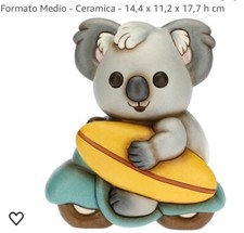 Koala con Tavola da Surf su Moto
