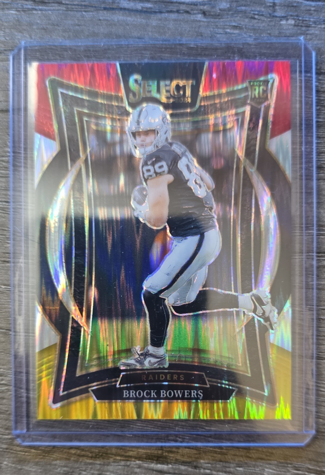 2024 Panini Select - Concourse Brock Bowers #31 Red & Yellow Shock Prizm (RC)