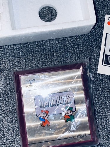 Juego y reloj Nintendo MW-56 multipantalla Mario Bros. 1983 vintage con caja e insertos - Imagen 3 de 10