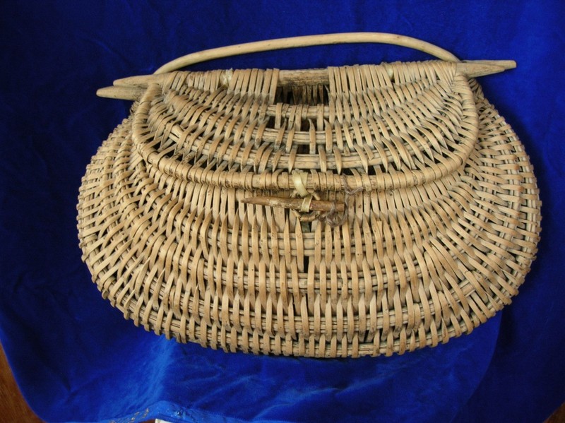 Vintage watermelom-shaped hand woven fishing creel with wooden handles.