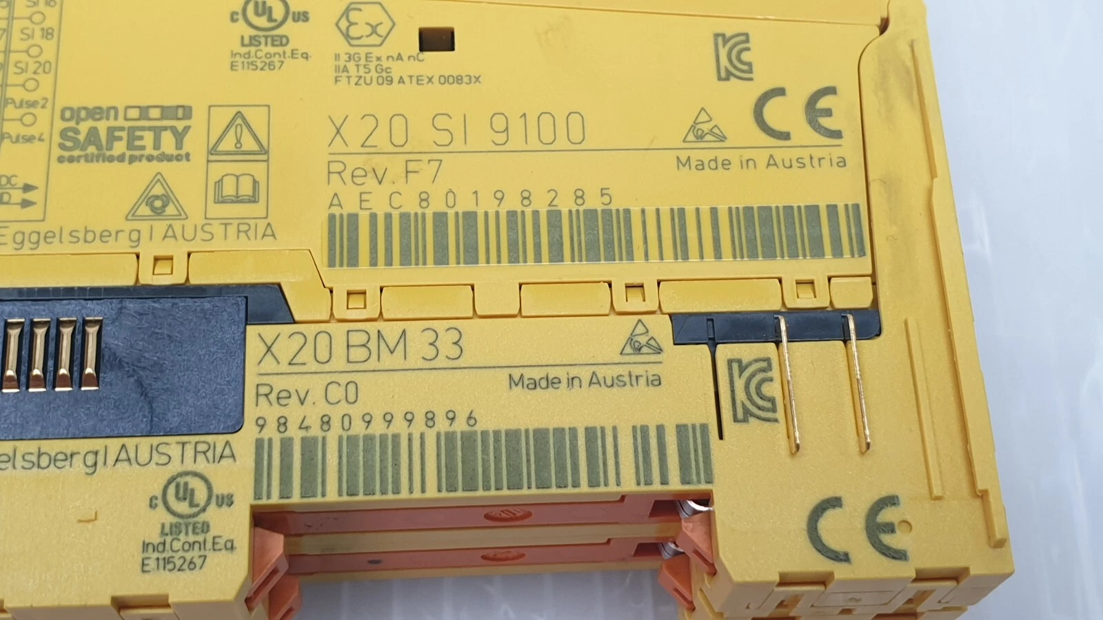 Close-up of labels: X20 SI 9100 Rev. F7 and X20 BM 33 Rev. C0, made in Austria