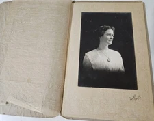 Vint photo in folder as shown Is 5.75x4" Folder is 6x9" Lady Named on back.