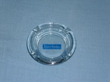 Travelodge Ashtray 4 1/2" Round Four Rests Clear Glass with blue name