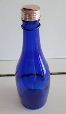COBALT BLUE BOTTLE SOLID DESIGN WITH A PINK METAL LID 8.25 INCHES HOLDS 12 OZS