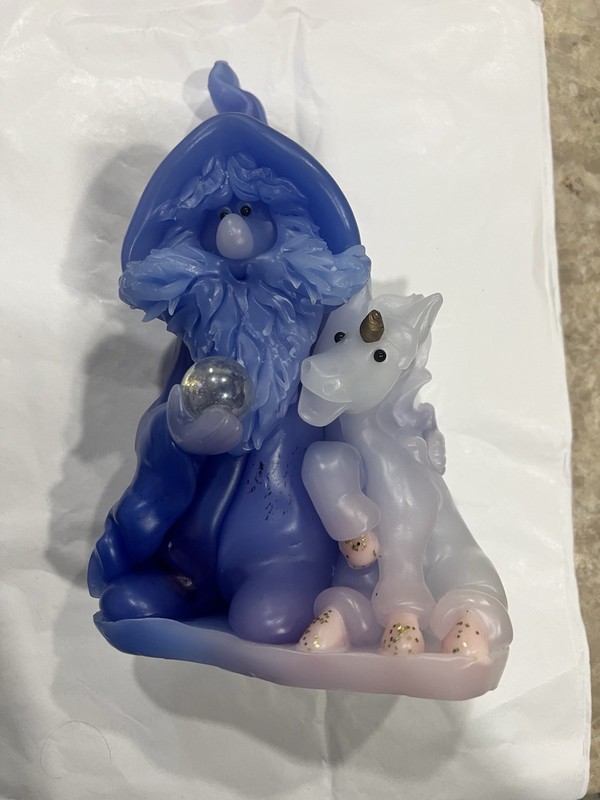 Wee Wizards" handcrafted figural candle featuring a wizard and a unicorn