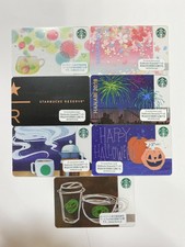 misc cards with pin intact//stickers Starbucks Cards