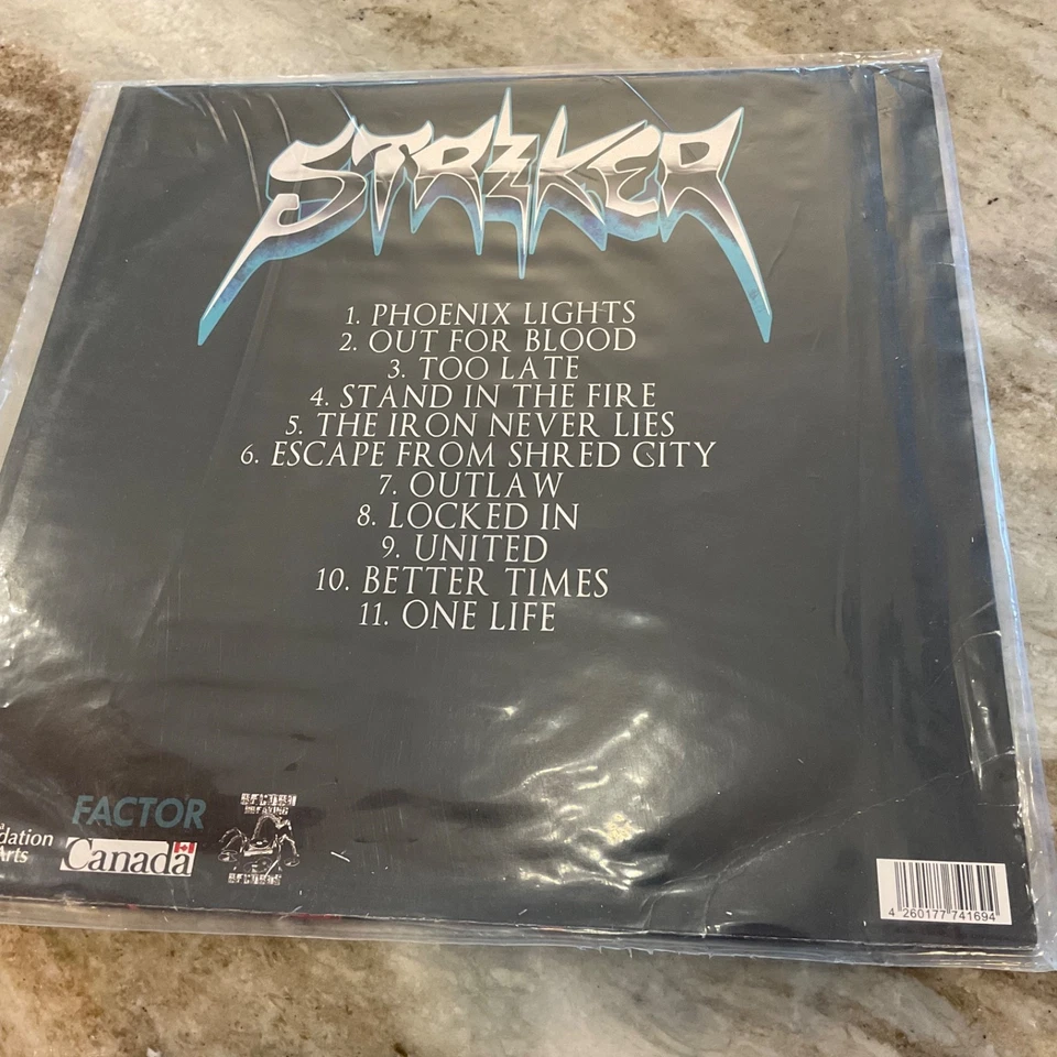 STRIKER LP STAND IN THE FIRE 2016 CANADIAN ORANGE VINYL M/VG+  RBR01LP - Image 2 of 3