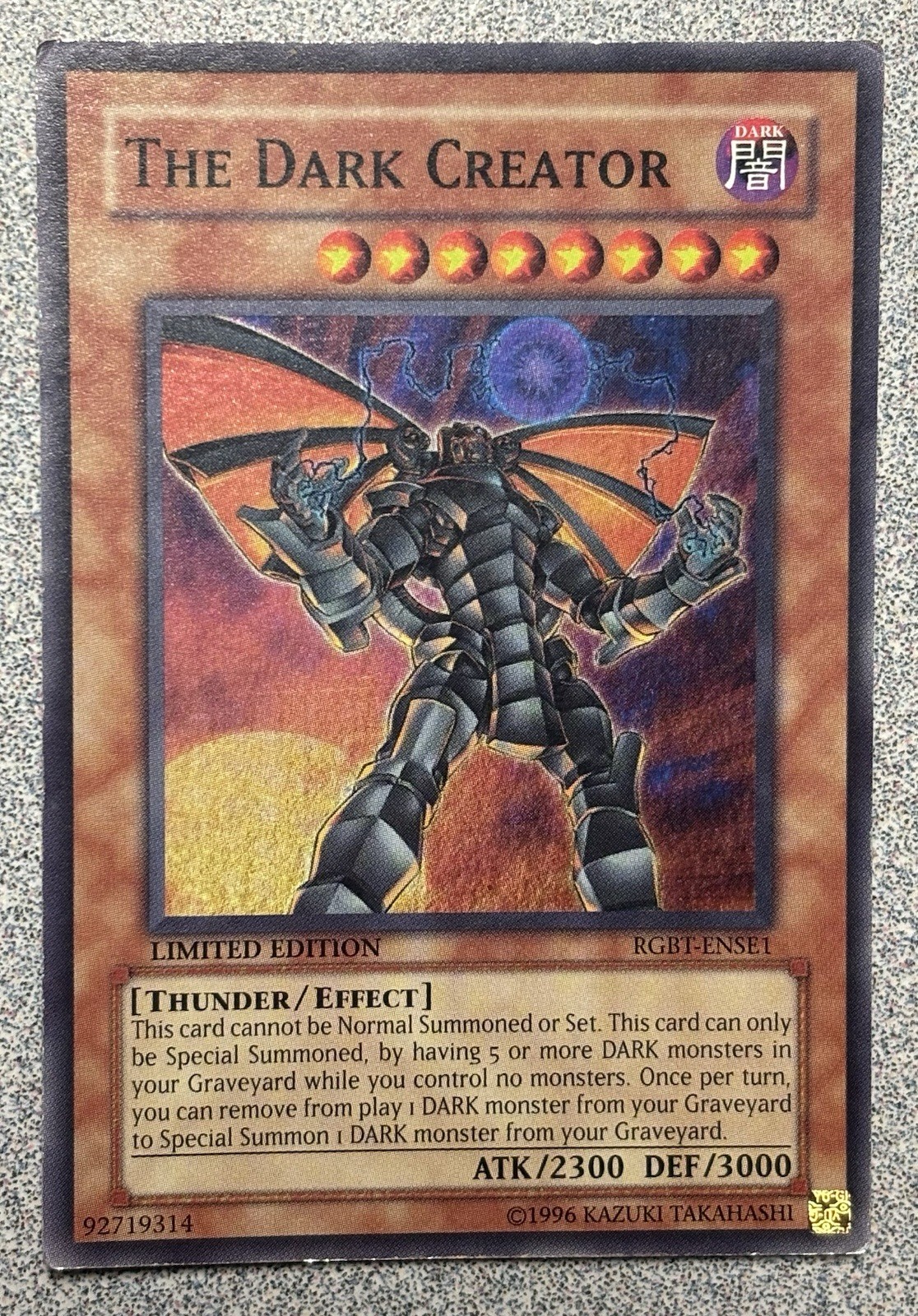 The Dark Creator RGBT-ENSE1 YuGiOh Raging Battle trading card — raw and PSA graded price guide